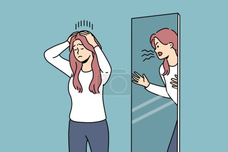 Illustration for Woman is trying to restrain aggression, standing near mirror with angry reflection, for concept of mental disorder. Girl with mental problems or split personality needs help of psychotherapist - Royalty Free Image