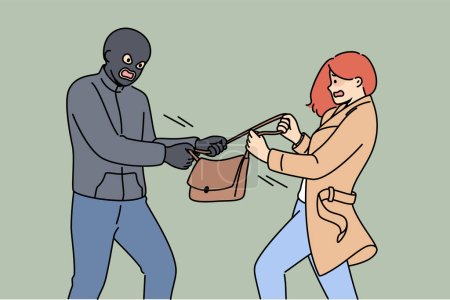 Maskierter Räuber nimmt verängstigte Frau Handtasche weg, die um Hilfe schreit und ihre persönlichen Sachen nicht Kriminellen überlassen will Räuber stiehlt Handtasche und will Portemonnaie und Handy des Opfers.