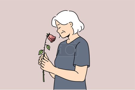 Ältere Frau fühlt verblassende und schwächende Gesundheit oder nähert sich dem Tod, hält welke Rose. Witwe erlebt Apathie aufgrund des schwindenden Alters, für Konzept des Alterns und Bedeutung moralische Unterstützung für Rentner