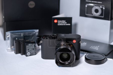 London, UK - 2022.12.21: Beautiful vintage looking modern digital Leica Q camera in front of the box and accessories