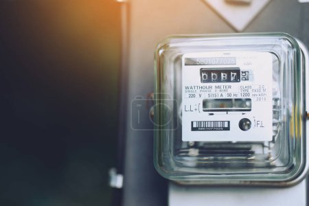 Photo for Electric power meter measuring power usage. Watt hour electric meter measurement tool at pole, outdoor electricity for use in home appliance monitor the home's electrical energy consumption. - Royalty Free Image