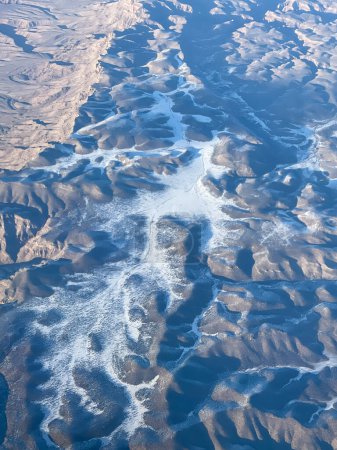 Photo for Flying over the desert after leaving Las Vegas in January - Royalty Free Image