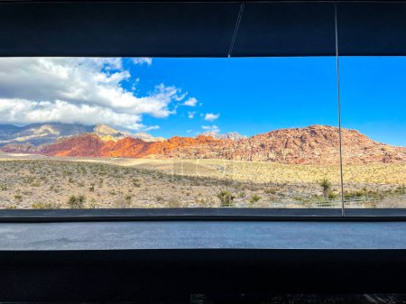 Photo for Looking out window at rocky red desert mountain in Nevada Red Rocks visitor center - Royalty Free Image