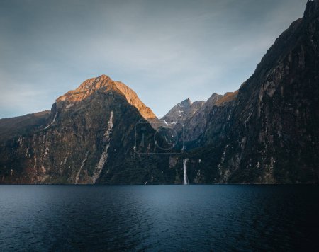 Photo for Stirling falls in milford sound during sunset with evening light in fiordland national park, southland, south island, new zealand. Photo taken in New Zealand. - Royalty Free Image