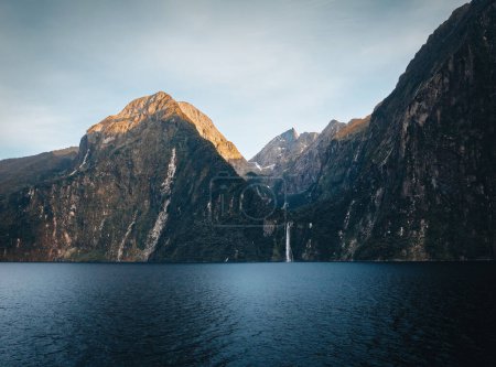 Photo for Stirling falls in milford sound during sunset with evening light in fiordland national park, southland, south island, new zealand. Photo taken in New Zealand. - Royalty Free Image