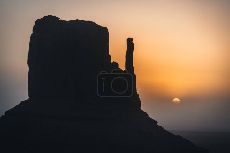 Photo for Monument Valley USA Utah during Sunset and sunrise with famout view to the sisters and west mitten butte. Photo taken in Utah - Royalty Free Image