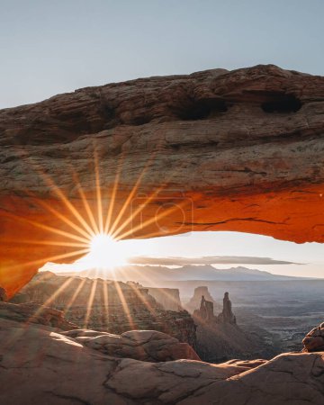Photo for View through Natural Arch, Mesa Arch, Sunrise, Grand View Point Road, Island in the Sky, Canyonlands National Park, Moab, Utah, USA, North America. Photo taken in USA. - Royalty Free Image