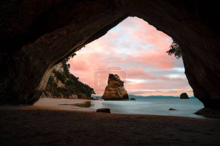 Photo for Cathedral cove beach, coromandel, north island, new zealand. Sunset view with colorful sky. Photo taken in New Zealand. - Royalty Free Image