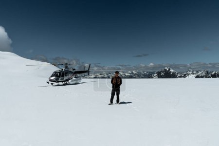 Photo for Helicopter snow Landing in new Zealand. Tourist enjoying ride. Franz Josef Glacier snow landing, New Zealand. - Royalty Free Image
