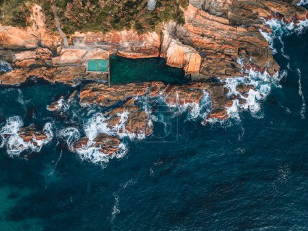 Photo for Aerial drone view of Blue Pool in Bermagui during sunrise sunset with blue sky and reflection. New South Wales, Australia. - Royalty Free Image