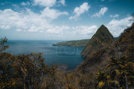Photo for Pitons on Santa Lucia, La Souffriere bay during sunset with blue sky and cotton candy clouds. Caribbean Island. Vieux Fort, Saint Lucia. Travel and honeymoon concept. Photo taken in St. Lucia. - Royalty Free Image