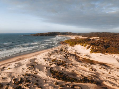 Photo for Aerial Drone view One Mile Beach during sunrise sunset with sand dunes. Forster, Great Lakes, Australia. - Royalty Free Image