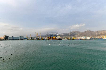 Photo for Novorossiysk, Russia - Jan 9, 2022: Cargo ships and cranes at the port of Novorossiysk. - Royalty Free Image