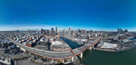Aerial view of the Pulaski Bridge which crosses the Newtown Creek and connects Brooklyn and Long Island City on a cloudy day with no traffic on the water or on the road.