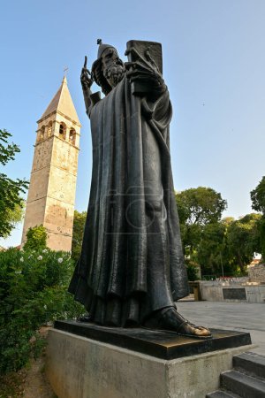 Monumental bronze statue of Bishop Gregory of Nin created in 1929 by Ivan Mestrovic and Saint Rainier Benedict monastery belfry