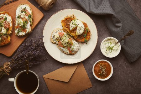 Photo for Low-Carb Cuisine sandwiches with zucchini spread and yogurt, egg, salmon, coffee cup. Low in calories, FODMAP, KETO diet, superfood - Royalty Free Image