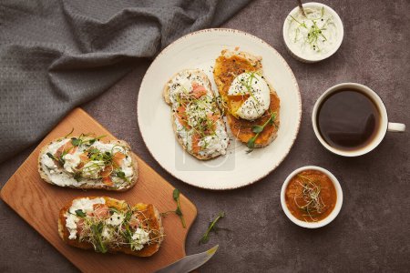 Photo for Healthy breakfast - sandwiches with zucchini spread and greek yogurt, egg, salmon, coffee cup. Low in calories, FODMAP, KETO diet, superfood flat lay - Royalty Free Image