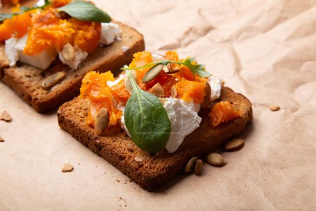 Vegetarian toast with a rich topping of pumpkin and mixed seeds. Rustic comfort food.