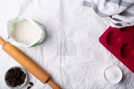 Photo for Preparation for Valentine's Treats - Ingredients and Tools on a Kitchen Table. - Royalty Free Image