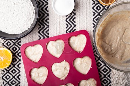 Homemade Heart Muffins, baking at home flat lay.
