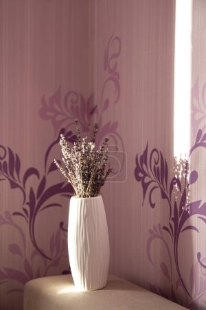 Serene Lavender - Vase of Dried Flowers Against a Patterned Backdrop.