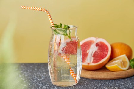 Vitaminized summer detox water. Aesthetic refreshing cocktails with citrus fruits. Low-alcohol drinks, hard seltzer cocktail concept.