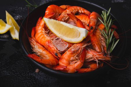 Appetizing prawns with lemon and herbs, presented for gourmet recipes or healthy eating guides.