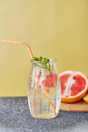 Healthy summer vitaminized non alcoholic citrus detox with grapefruit, lemon, strawberry and mint. Summer refreshing vitaminised carbonated water.