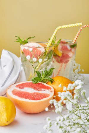 Aesthetic summer cocktails with citrus fruits. Vitaminized detox water. Low alcohol, zero proof drinks