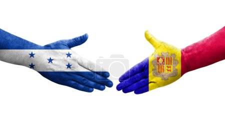 Foto de Mano apretada entre banderas de Andorra y Honduras pintadas en las manos, imagen transparente aislada. - Imagen libre de derechos