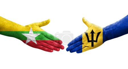 Foto de Apretón de manos entre Barbados y Myanmar banderas pintadas en las manos, imagen transparente aislada. - Imagen libre de derechos
