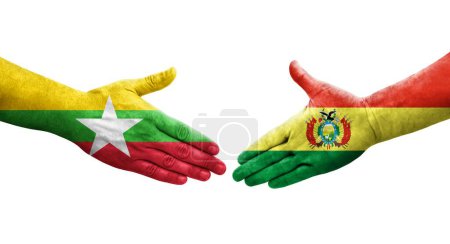 Foto de Apretón de manos entre Bolivia y Myanmar banderas pintadas en las manos, imagen transparente aislada. - Imagen libre de derechos