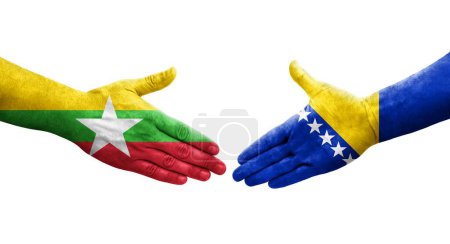 Foto de Apretón de manos entre Bosnia y Myanmar banderas pintadas en las manos, imagen transparente aislada. - Imagen libre de derechos