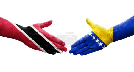 Téléchargez les photos : Poignée de main entre la Bosnie et Trinité Tobago drapeaux peints sur les mains, image transparente isolée. - en image libre de droit