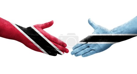 Téléchargez les photos : Poignée de main entre les drapeaux Botswana et Trinité Tobago peints sur les mains, image transparente isolée. - en image libre de droit