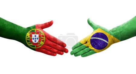 Handshake between Brazil and Portugal flags painted on hands, isolated transparent image.
