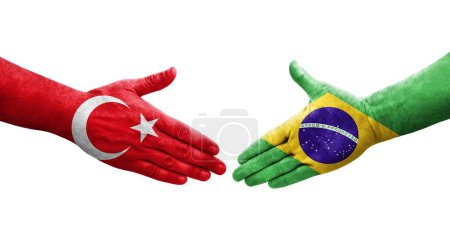 Photo for Handshake between Brazil and Turkey flags painted on hands, isolated transparent image. - Royalty Free Image