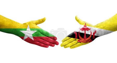 Foto de Apretón de manos entre Brunei y Myanmar banderas pintadas en las manos, imagen transparente aislada. - Imagen libre de derechos