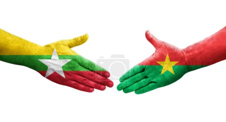 Foto de Apretón de manos entre Burkina Faso y Myanmar banderas pintadas en las manos, imagen transparente aislada. - Imagen libre de derechos