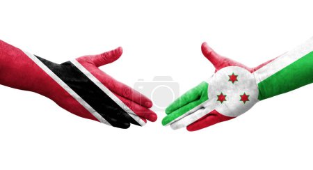 Téléchargez les photos : Poignée de main entre le Burundi et Trinité Tobago drapeaux peints sur les mains, image transparente isolée. - en image libre de droit
