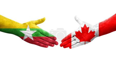 Foto de Apretón de manos entre Canadá y Myanmar banderas pintadas en las manos, imagen transparente aislada. - Imagen libre de derechos