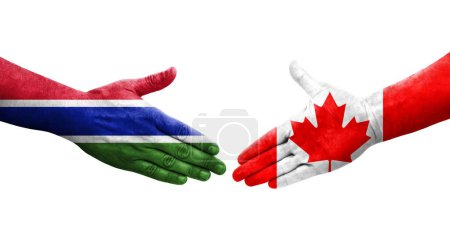 Foto de Apretón de manos entre Canadá y Gambia banderas pintadas en las manos, imagen transparente aislada. - Imagen libre de derechos
