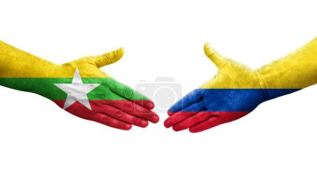 Foto de Apretón de manos entre Colombia y Myanmar banderas pintadas en las manos, imagen transparente aislada. - Imagen libre de derechos