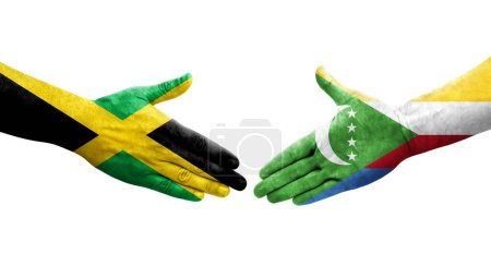 Photo for Handshake between Comoros and Jamaica flags painted on hands, isolated transparent image. - Royalty Free Image