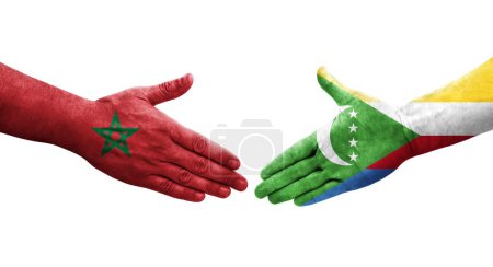 Photo for Handshake between Comoros and Morocco flags painted on hands, isolated transparent image. - Royalty Free Image
