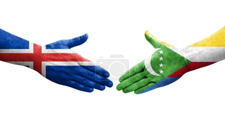 Photo for Handshake between Comoros and Iceland flags painted on hands, isolated transparent image. - Royalty Free Image