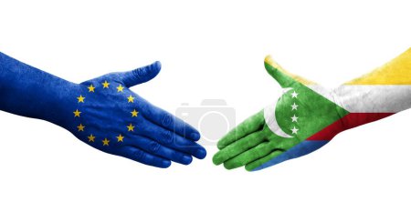 Photo for Handshake between Comoros and European Union flags painted on hands, isolated transparent image. - Royalty Free Image