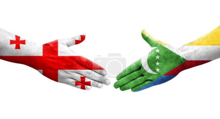 Photo for Handshake between Comoros and Georgia flags painted on hands, isolated transparent image. - Royalty Free Image