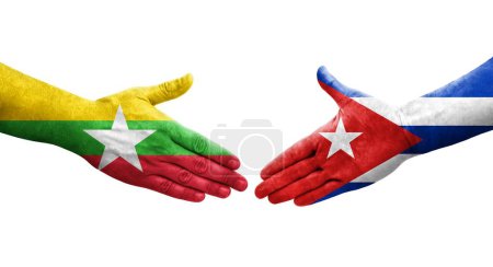 Foto de Mano apretada entre banderas de Cuba y Myanmar pintadas en las manos, imagen transparente aislada. - Imagen libre de derechos