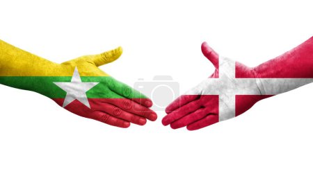 Foto de Apretón de manos entre Dinamarca y Myanmar banderas pintadas en las manos, imagen transparente aislada. - Imagen libre de derechos